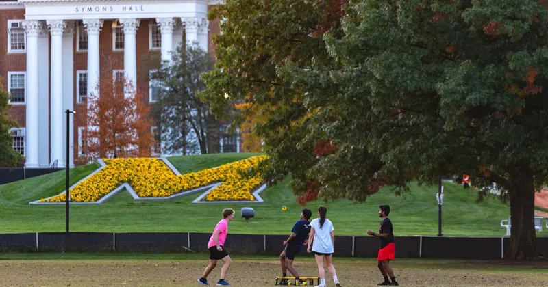 Large "M" in flowers on the lawn